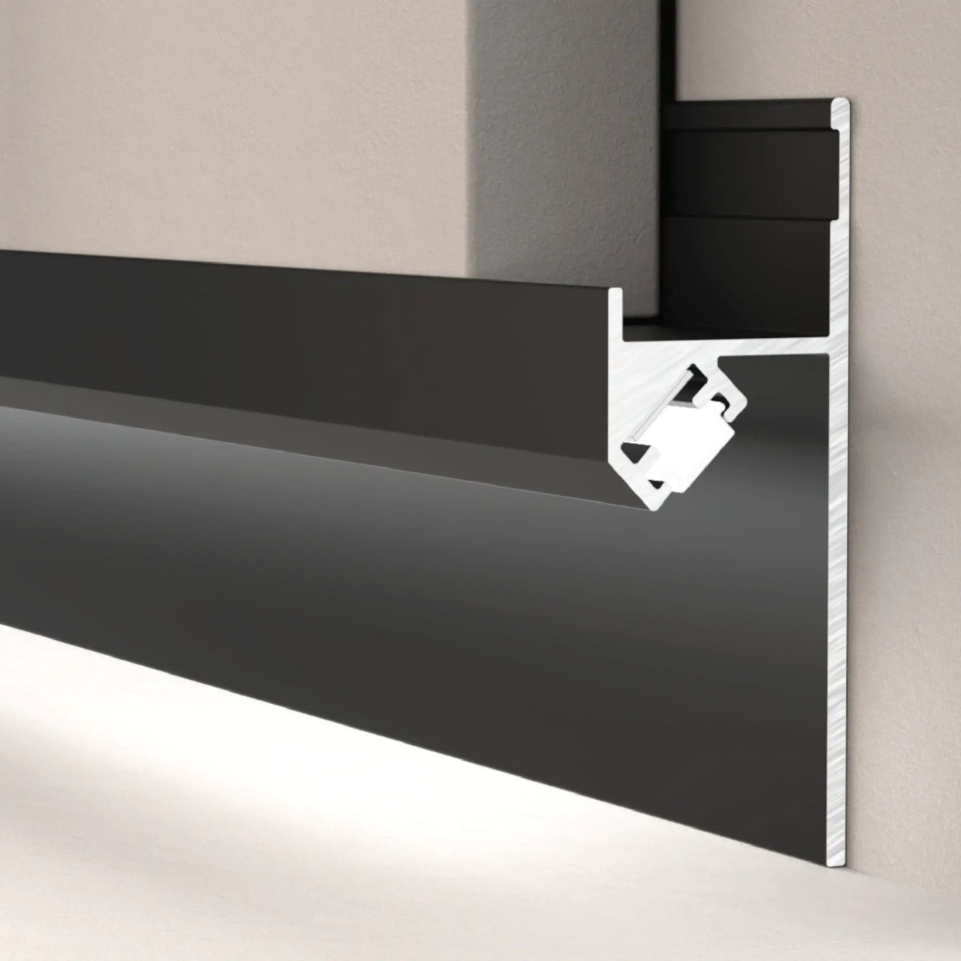 Double LED Skirting Profile with dark architectural finish and concealed downward lighting channel